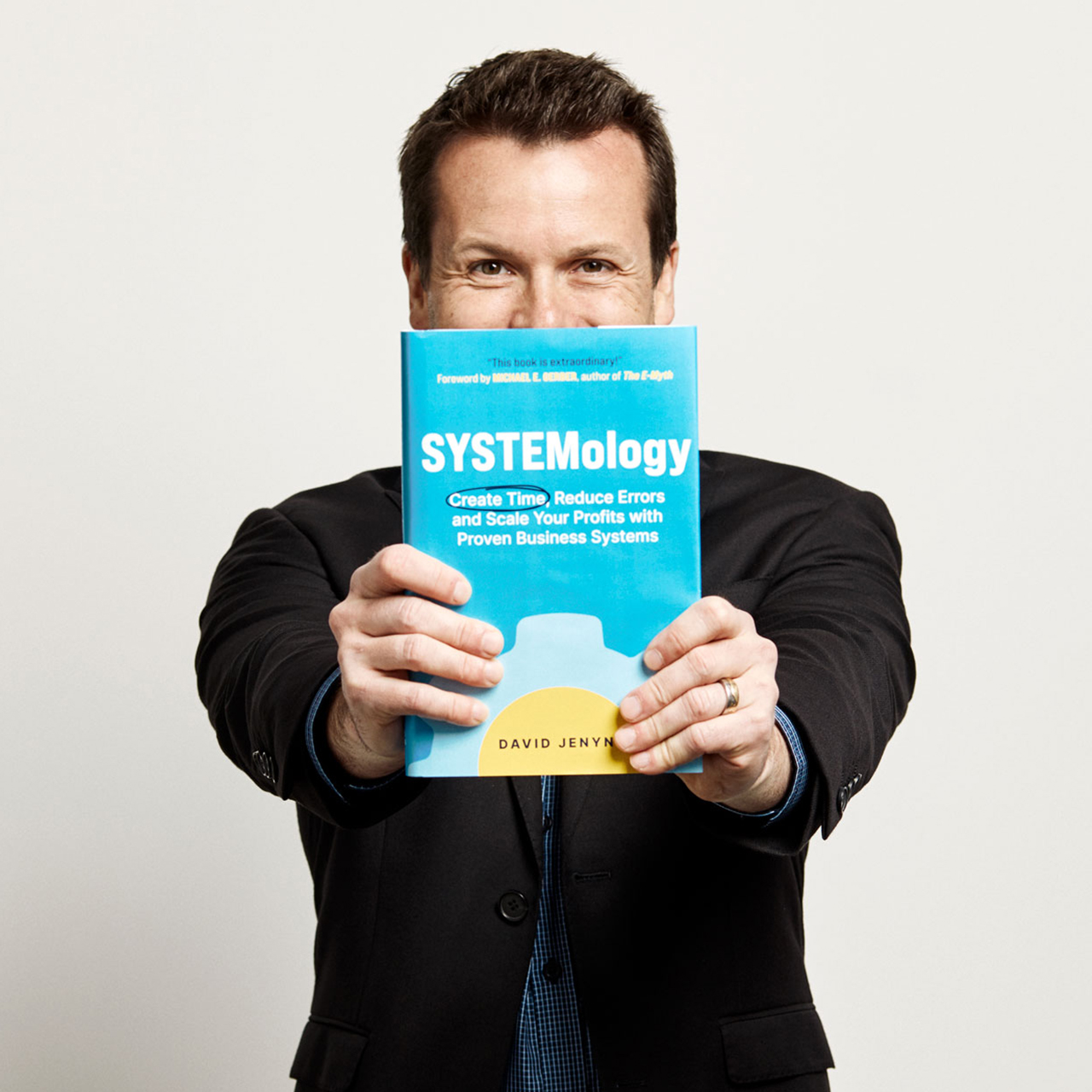David Jenyns holding book